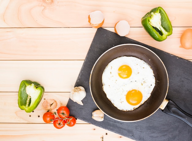 Breakfast with eggs and frying pan