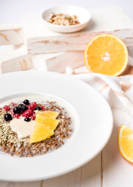 Breakfast with orange slices and seeds high view