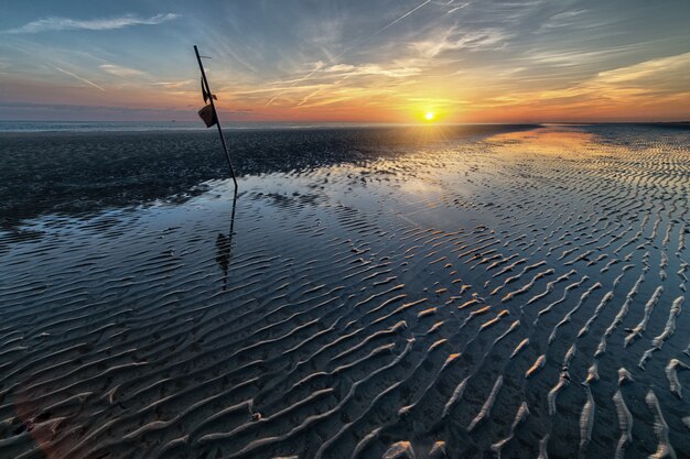 Breathtaking early morning scenery of the sun rising over the ocean