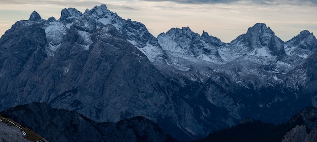 Free Photo breathtaking panoramic shot of the evening in the snowy italian alps