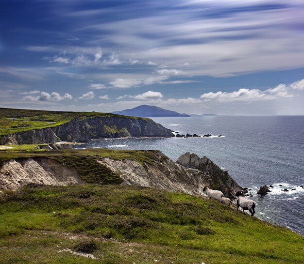 Breathtaking scene of Achill Island beside a sea on a cloudy day