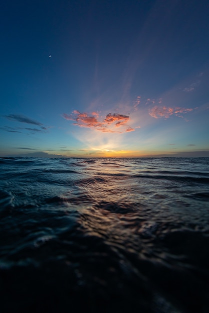 Breathtaking scenery of the sun setting over the ocean in Bonaire, Caribbean