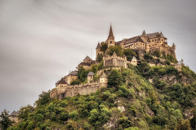 Free photo breathtaking view of castles and fortresses on top of a hill surrounded by trees