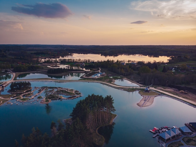 Breathtaking view of lakes and forests during sunset