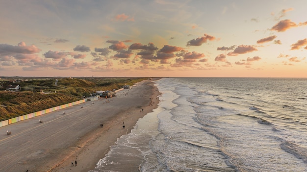 Free photo breathtaking view of the wavy ocean under the cloudy sky in domburg, netherlands