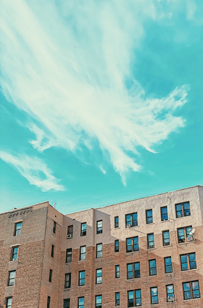 Brick building with windows and blue sky