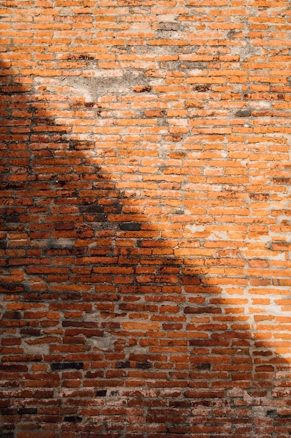 Free photo brick wall background in light and shadow