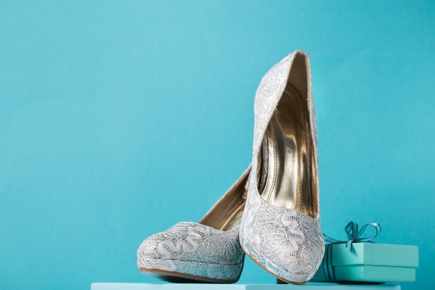 Bridal shoes on blue background