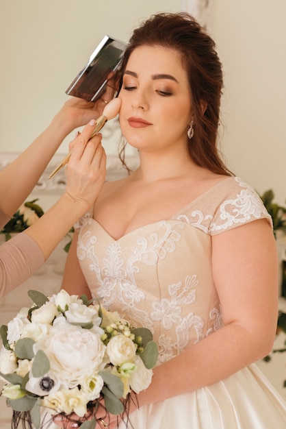 Bride getting  her make up ready