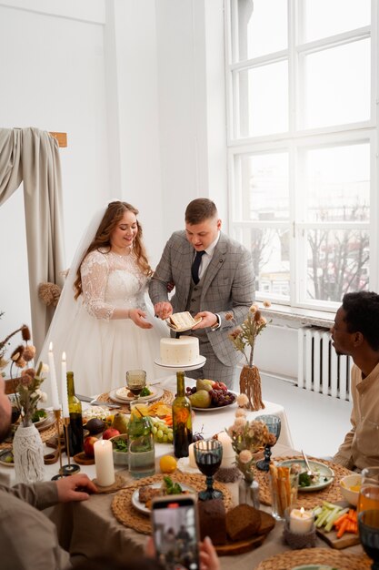 Bride and groom cutting the cake at their wedding