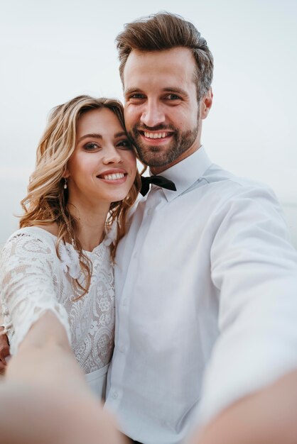 Bride and groom having a beach wedding