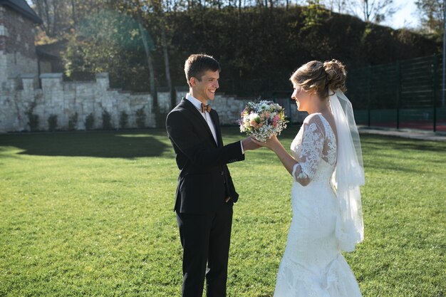 Bride and groom having fun in an old town