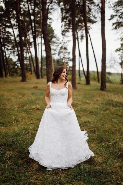 The bride and groom run through a forest Wedding photo shoot