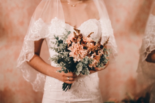 Bride holding the beautiful wedding bouquet