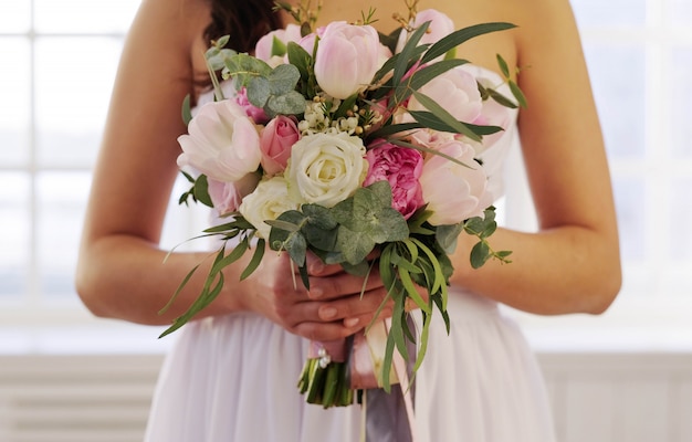 Bride holding floral bouquet