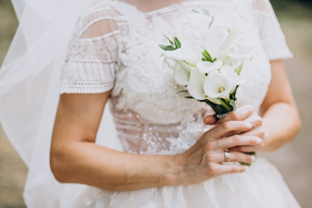 Bride holding her bouquet on her wedding day