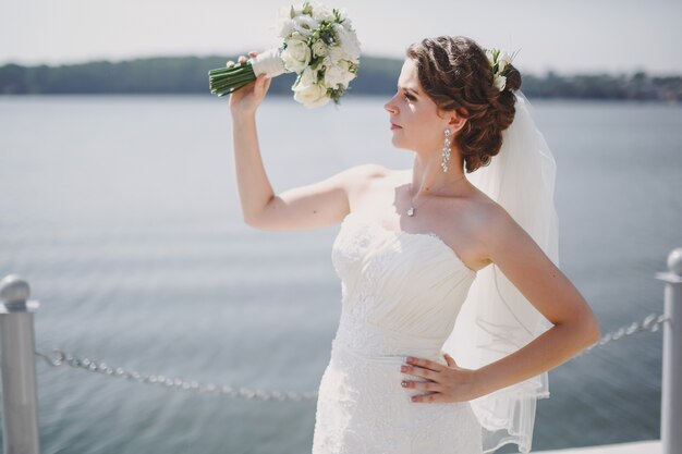 Bride looking his bouquet