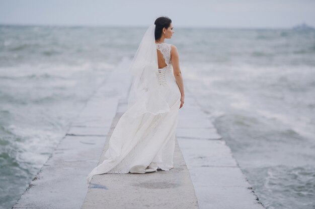 Bride looking at the sea