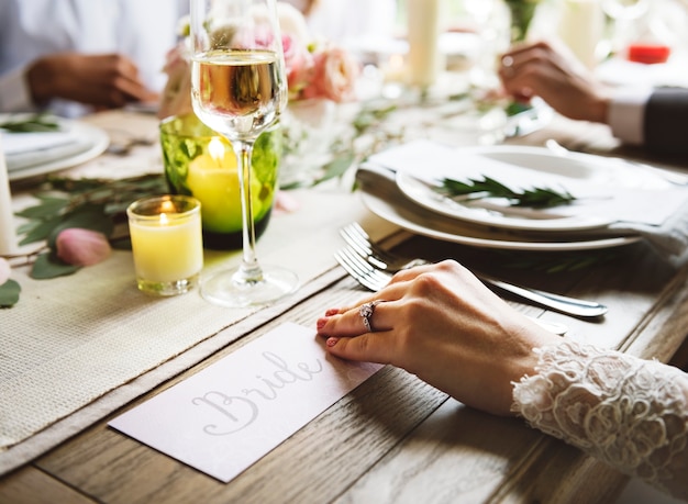 Bride showing Enagaement Ring on Left Hand on Wedding Celebration with Family