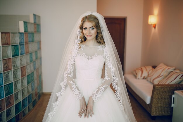 Bride smiling with wedding dress