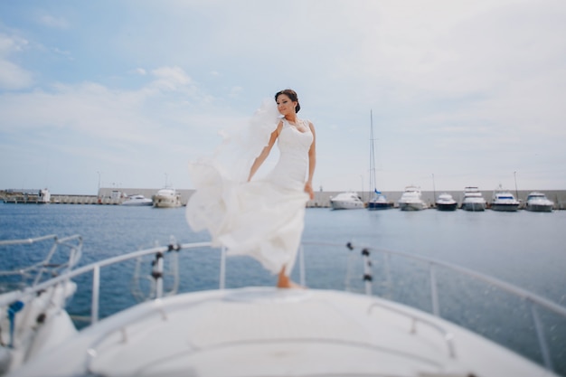 Bride with her dress in the wind