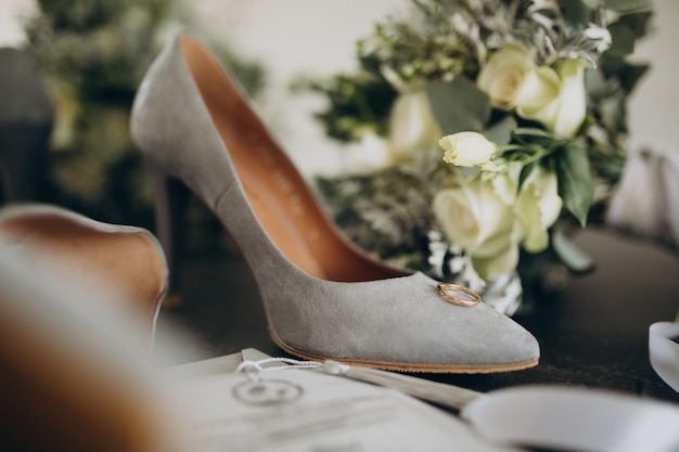 Brides wedding shoes with wedding bouquet