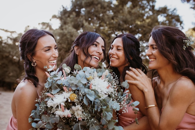 Bridesmaids in pretty dresses outdoors