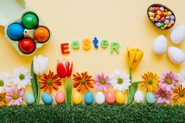 Bright arrangement of Easter eggs and flower