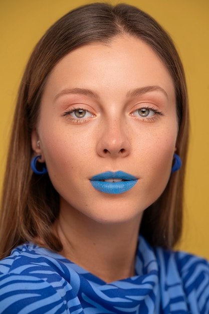 Free photo bright blue lips portrait with copy space