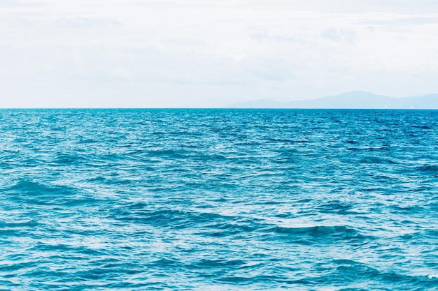 Bright Blue ocean with smooth wave background.