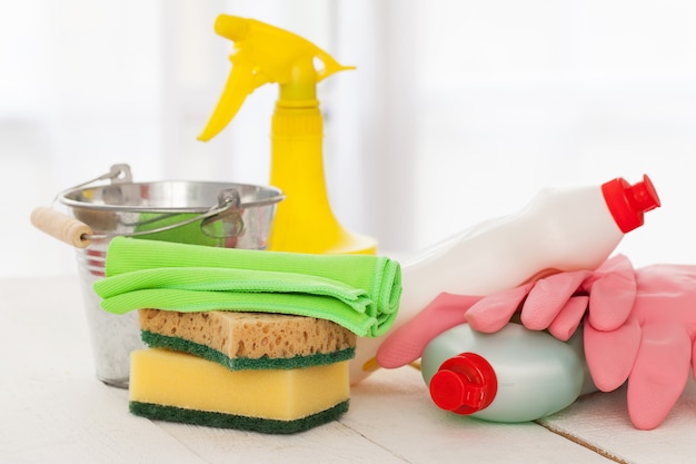 Bright colorful cleaning set on a wooden table