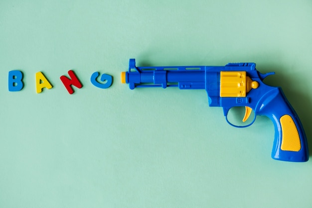 Free Photo bright and colorful plastic toy gun