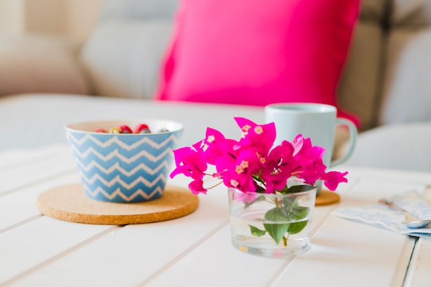 Bright flowers decorating breakfast table