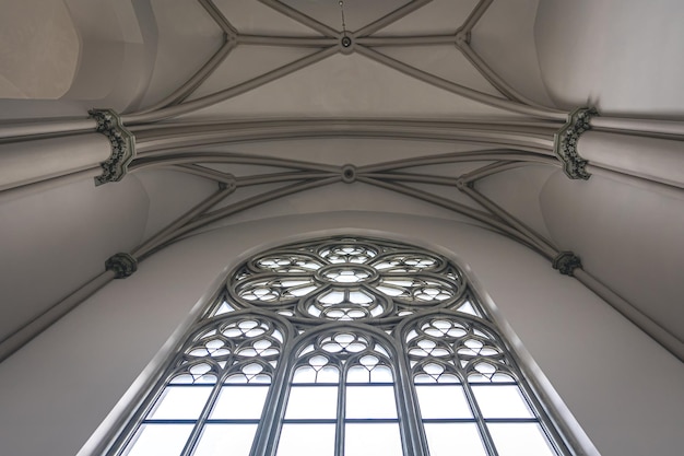 Free Photo bright interior of the church with stainedglass windows view from below