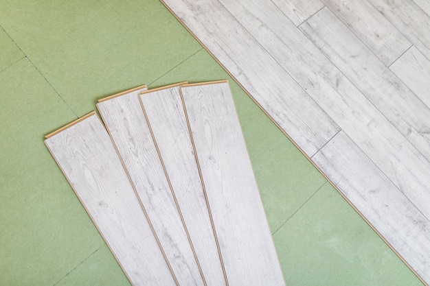 Free photo bright laminated flooring boards on gray