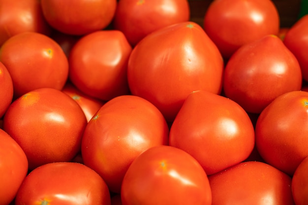 Bright red tomatoes in close-up.