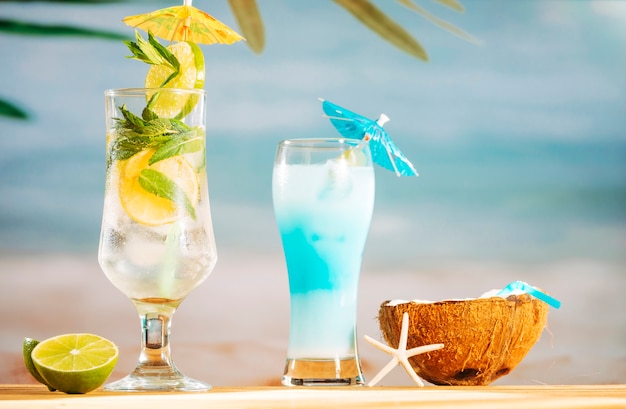 Bright umbrella decorated cocktails lime and coconut milk with straw