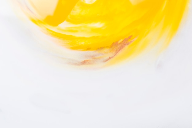 Free photo bright yellow watercolor forming semi circle on white paper