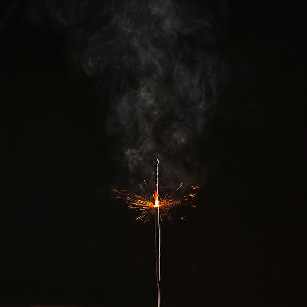 Free photo brightly flaming sparkler