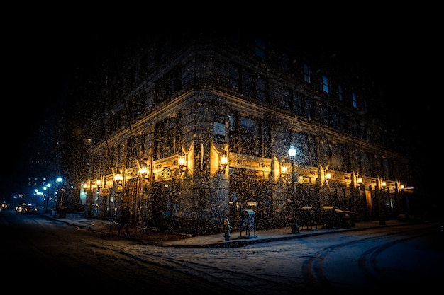 Free photo brightly lit corner of a building at night