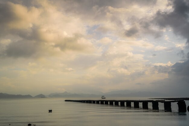 Broken pier in the lake during the sunrise in Hong Kong