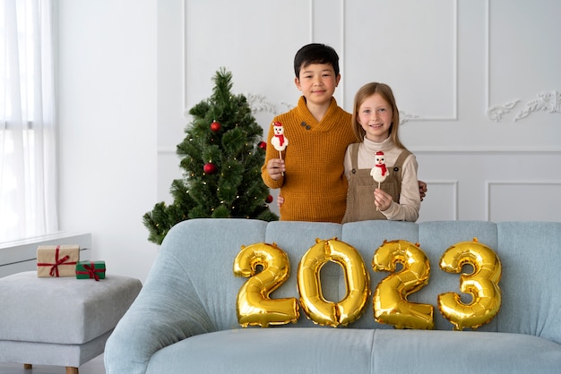 Brother and sister celebrating new years eve at home together