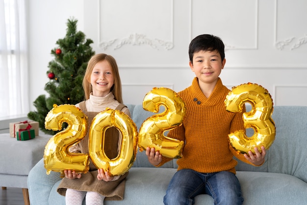 Brother and sister celebrating new years eve at home together