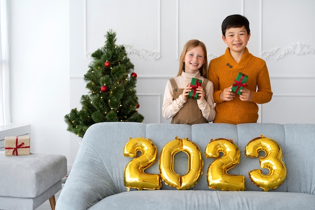 Brother and sister celebrating new years eve at home together