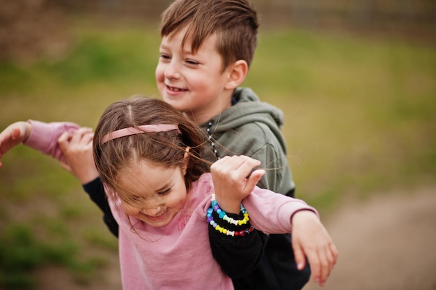 Free Photo brother with sister play in vineyard