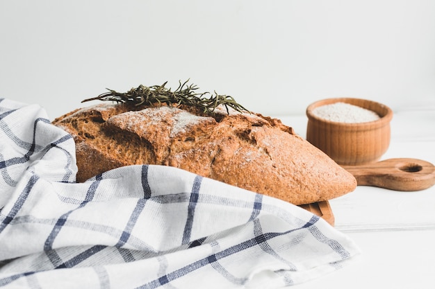 Free Photo brown baked loaf bread with herb