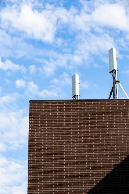 Free Photo brown brick building with blue sky