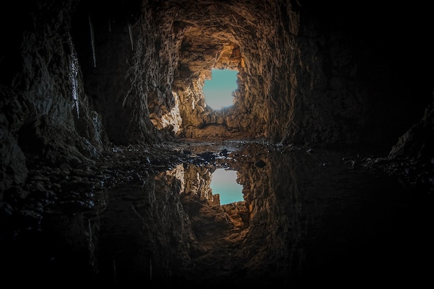 Brown concrete tunnel during daytime