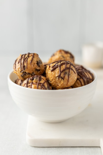 Brown cookies on white ceramic bowl