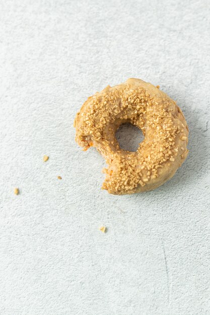 Brown doughnut on white textile